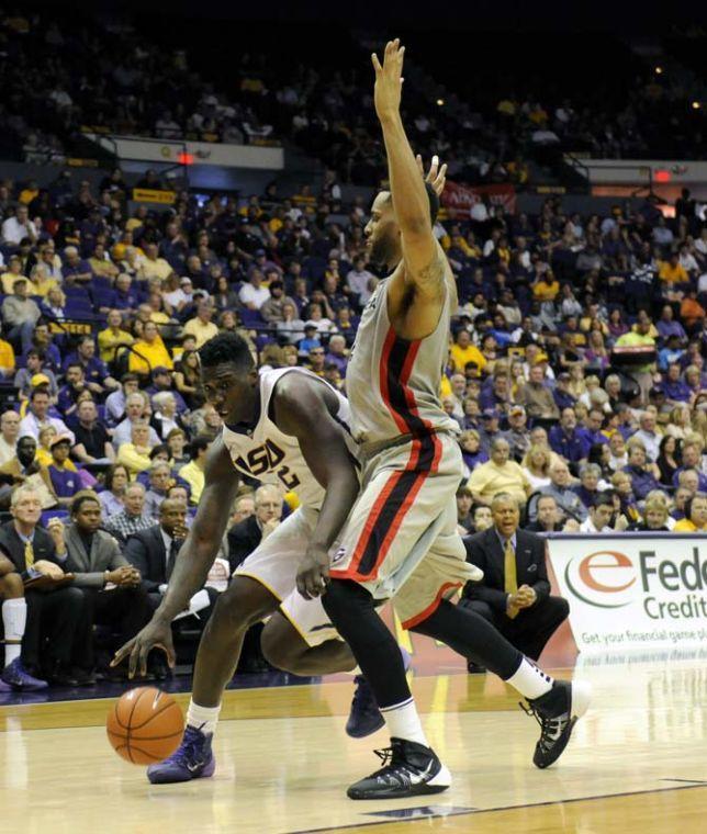 LSU junior forward Johnny O'Bryant III (2) dribbles around a defender Saturday, March 8, 2014 during the Tigers' 61-69 loss to Georgia in the PMAC.