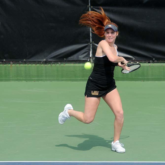 LSU freshman Abigail Owens returns a serve Sunday, March 9, 2014 during the Lady's Tigers' double match against Auburn at W.T. "Dub" Robinson Stadium.