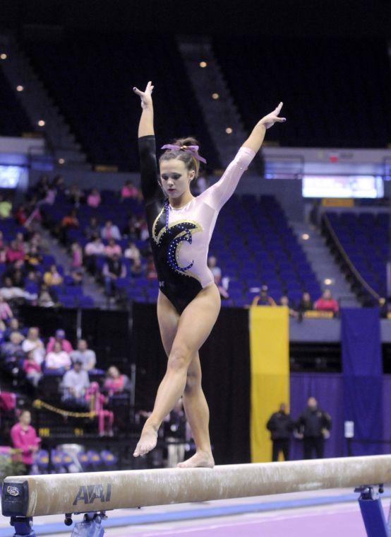 All-around gymnast Ashleigh Gnat performs her beam routine Friday, March 7, 2014 during the Tigers' 197.500 - 195.525 victory against NC State in the Pete Maravich Assembly Center.