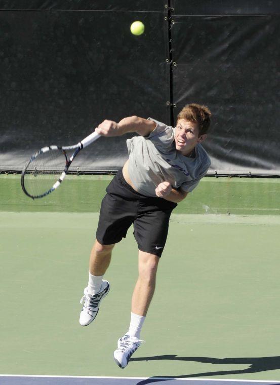 LSU junior Chris Simpson hits the ball during a match against George Washinton University on March 13, 2014 at the W.T. &#8220;Dub&#8221; Robinson Stadium.