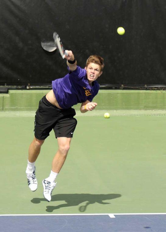 LSU junior Chris Simpson serves the ball Friday, March 7, 2014 during a tennis match against Alabama in W.T. "Dub" Robinson Stadium.