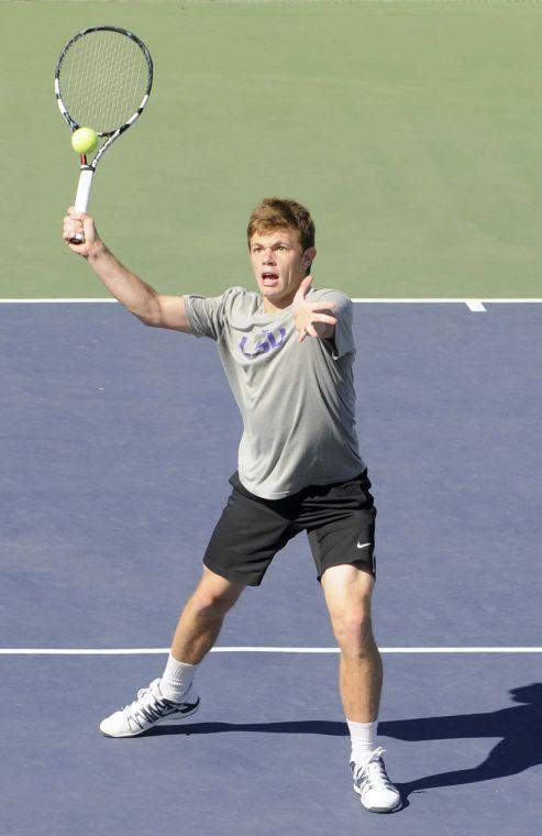 LSU junior Chris Simpson hits the ball during a match against George Washinton University on March 13, 2014 at the W.T. &#8220;Dub&#8221; Robinson Stadium.