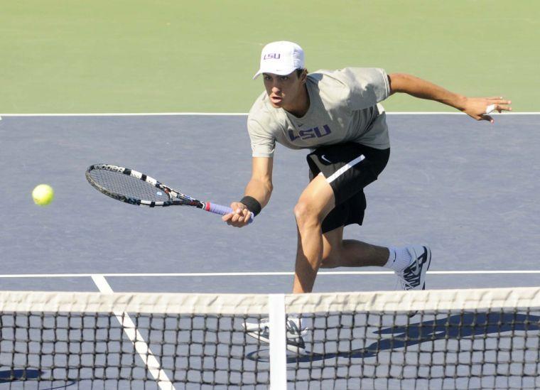 LSU freshman Justin Butsch hits the ball during a match against George Washinton University on March 13, 2014 at the W.T. &#8220;Dub&#8221; Robinson Stadium.