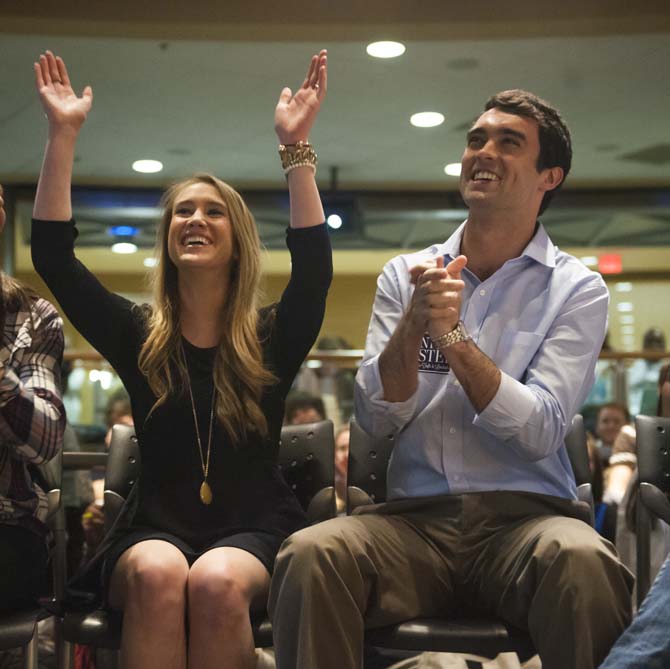 Newly-elected SG president Clay Tufts (right) and vice president Taylor Lambert (left) celebrate Wednesday, March 26, 2014, during SG election results announcements in the Student Union.