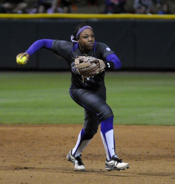 LSU sophomore infielder and pitcher Bianka Bell (27) throws the softball to second base during the Lady Tigers' 3-2 victory against the Gators on March 15, 2014 at Tiger Park.