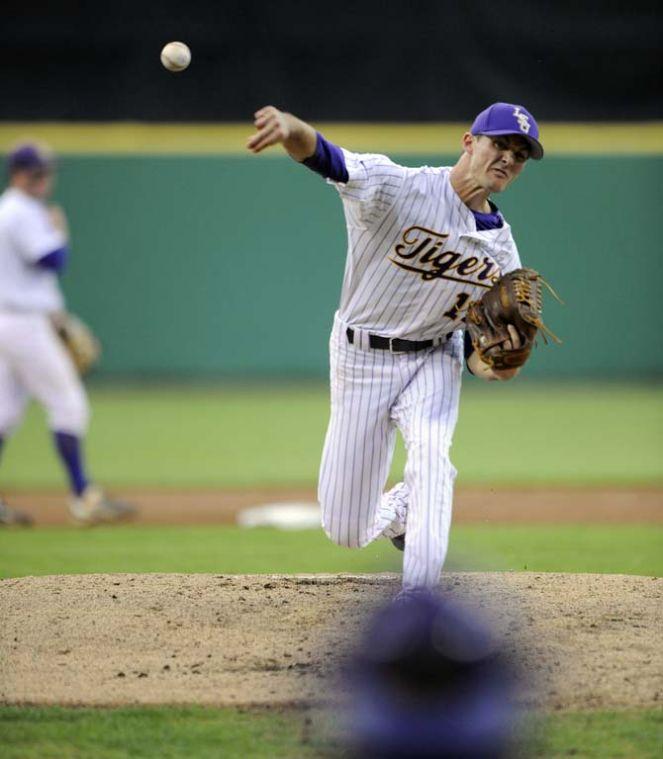 LSU junior pitcher Brady Domangue (13) warms up between innings Tuesday, March 11, 2014 during the Tigers' 5-3 win against Nicholls State in Alex Box Stadium.