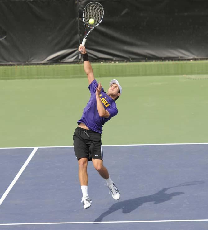 LSu sophomore Harrison Kennedy hits the ball Friday, March 7, 2014 during a tennis match against Alabama in W.T. "Dub" Robinson Stadium.