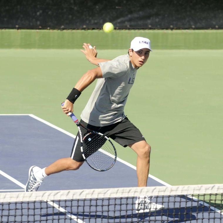 LSU freshman Justin Butsch lunges for the ball during a match against George Washinton University on March 13, 2014 at the W.T. &#8220;Dub&#8221; Robinson Stadium.