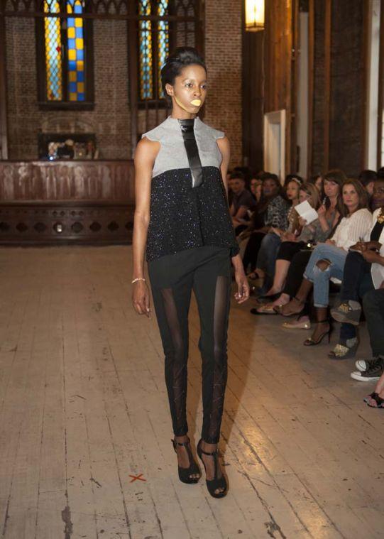 A model wearing a LSU senior an Alex Engelhardt "Xander" design showcases the clothing Sunday, March 16, 2014 at The Flelicity Church in New Orleans.