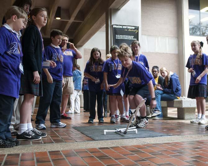 Middle school students launch a rocket Friday, March 28, 2014, during Space Day at Patrick F. Taylor Hall.