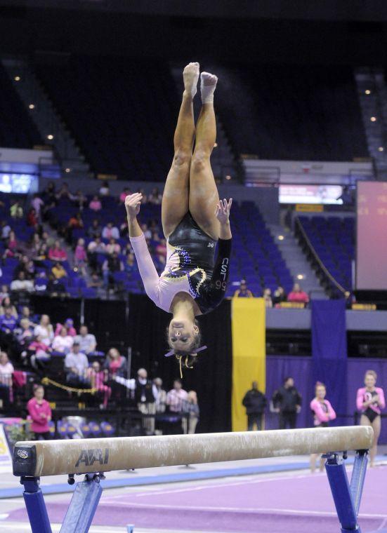 All-around gymnast Sydney Ewing flips during her beam routine Friday, March 7, 2014 during the Tigers' 197.500 - 195.525 victory against NC State in the Pete Maravich Assembly Center.