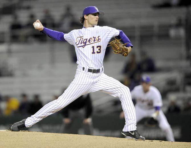 LSU junior right-handed pitcher Brady Domangue (13) prepares to hurl the ball towards home plate Wednesday, March 5, 2014 during the Tigers' 8-1 victory against Sacred Heart in Alex Box Stadium.