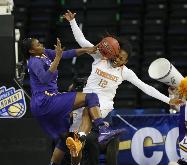 LSU forward Shanece McKinney (21) blocks Tennessee forward Bashaara Graves' shot during the first half in an NCAA college basketball game in the quarterfinals of the Southeastern Conference women's tournament, Friday, March 7, 2014, in Duluth, Ga. (AP Photo/John Bazemore)