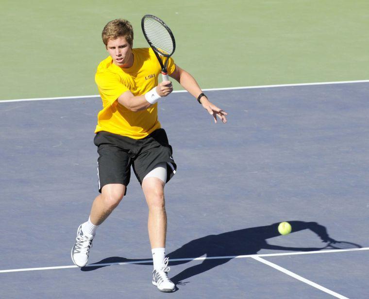 LSU sophomore Harrison Kennedy smacks the tennis ball during a match against George Washinton University on March 13, 2014 at the W.T. &#8220;Dub&#8221; Robinson Stadium.