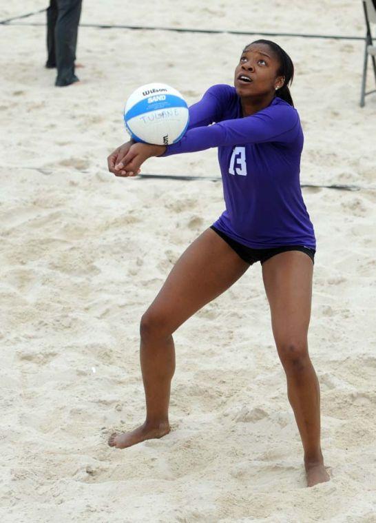 LSU freshman sand volleyball player Briana Holman (13) bumps the ball Wednesday, March 26, 2014, during the Tigers' 3-2 lost against Tulane at Coconut Beach Sand Volleyball Complex.