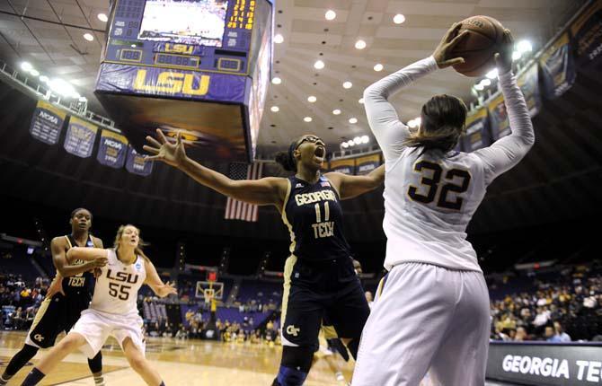 LSU sophomore guard Danielle Ballard (32) tries to pass the ball to a teammate despite blocking from Georgia Tech sophomore center Nariah Taylor (11) on Sunday, March 23, 2014, during the Tigers' 98-78 victory against Georgia Tech in the PMAC.