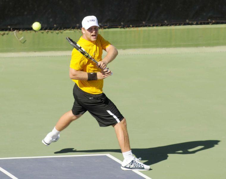 LSU sophomore Andrew Korinek makes a hit on the ball during a match against George Washinton University on March 13, 2014 at the W.T. &#8220;Dub&#8221; Robinson Stadium.