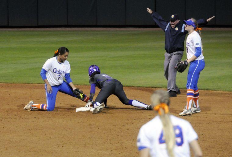 LSU junior outfielder AJ Andrews (6) is safe on the base during the Lady Tigers' 3-2 victory against the Gators on March 15, 2014 at Tiger Park.