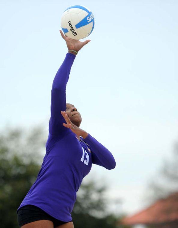 LSU freshman sand volleyball player Briana Holman (13) serves the ball Wednesday, March 26, 2014, during the Tigers' 3-2 lost against Tulane at Coconut Beach Sand Volleyball Complex.
