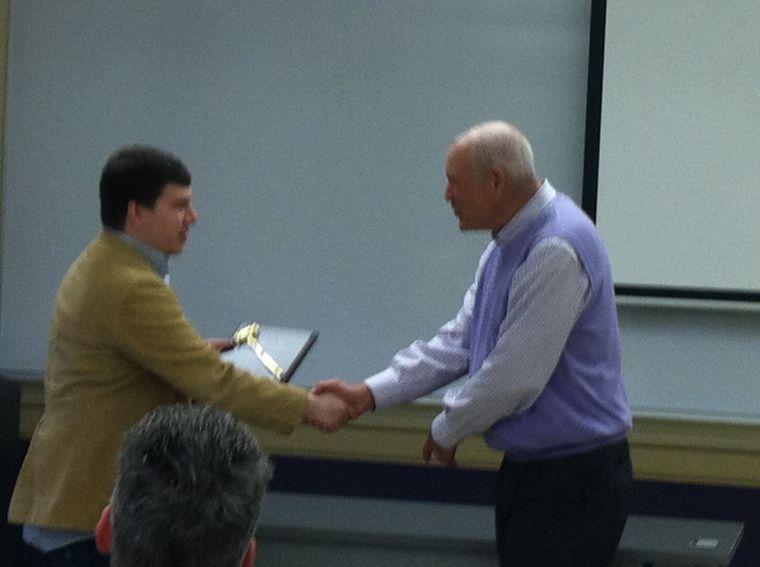 Edwin K. Hunter accepts his recognition from Speech and Debate coach Austin McDonlad.