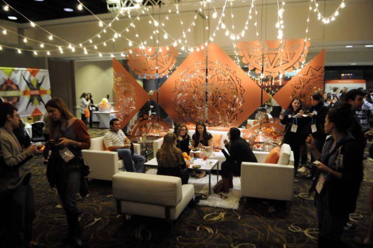 TribeFest event goers eat and socialize during the Purim seudah Sunday, March 16, 2014 at the Sheraton New Orleans Hotel.