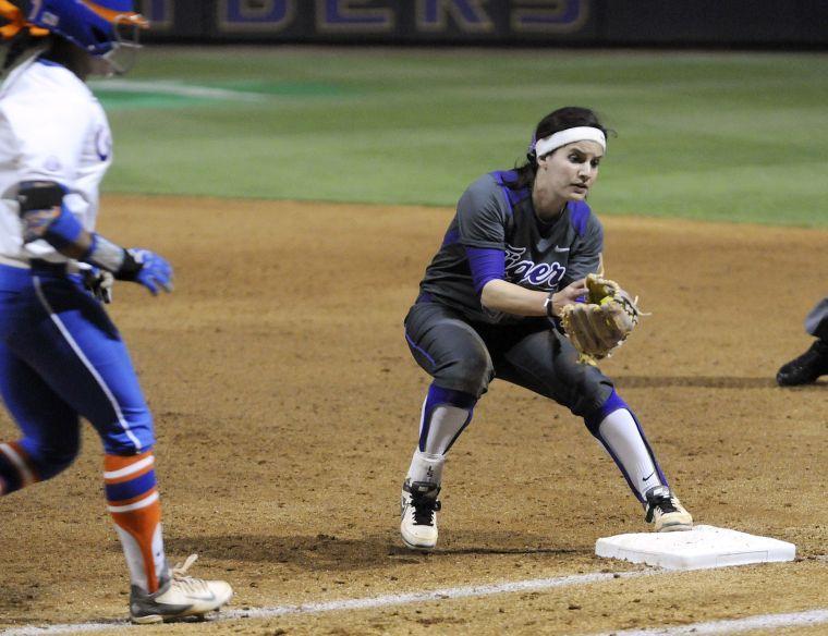 LSU senior infielder Allison Falcon (32) tags the base during the Lady Tigers' 3-2 victory against the Gators on March 15, 2014 at Tiger Park.