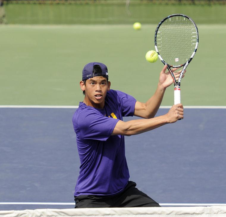 LSU sophomore Tam Trinh returns the ball Friday, March 7, 2014 during a doubles match against Alabama in W.T. "Dub" Robinson Stadium.