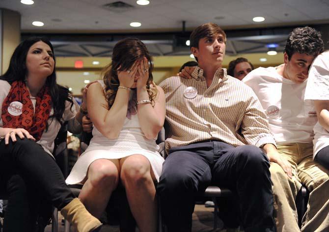 Student Government vice presidential candidate Ashleigh Pichon (left) and presidential candidate Christian Coleman (right) from the Experience LSU ticket react to election results Wednesday, March 26, 2014 after losing to The Next Step ticket in the Live Oak Lounge at the Student Union. Experience LSU received 44.1 percent of the votes, while The Next Step received 55.9 percent of the votes.