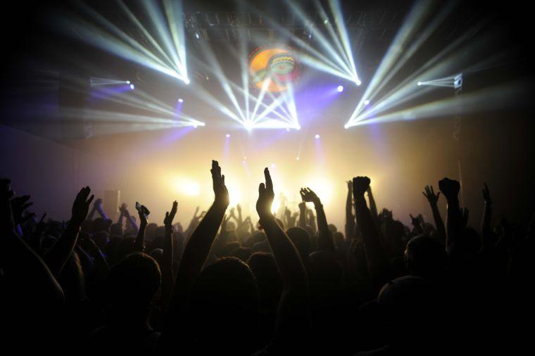 Fans raise their hands during Explosions In The Sky's set at Buku Music + Art Project on Saturday, March 22, 2014 at Mardi Gras World in New Orleans.