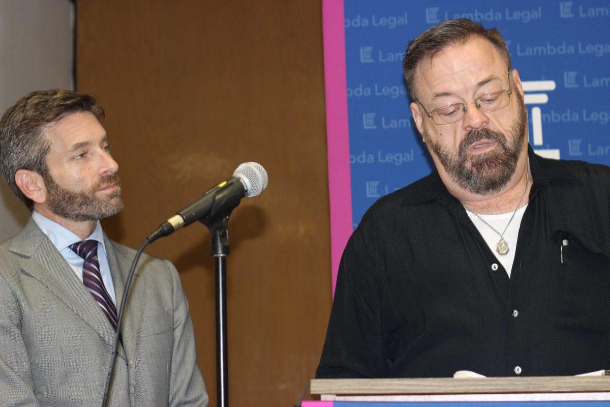 John East (left) and attorney Scott Schoettes discuss a lawsuit that the advocacy group Lambda Legal filed Thursday Feb. 20, 2014 against three Louisiana insurance companies. The suit asks the federal district court to make insurance companies in the state continue to take premium payments under the federal Ryan White program to help people with HIV and AIDS pay for health care. (AP Photo/Janet McConnaughey)