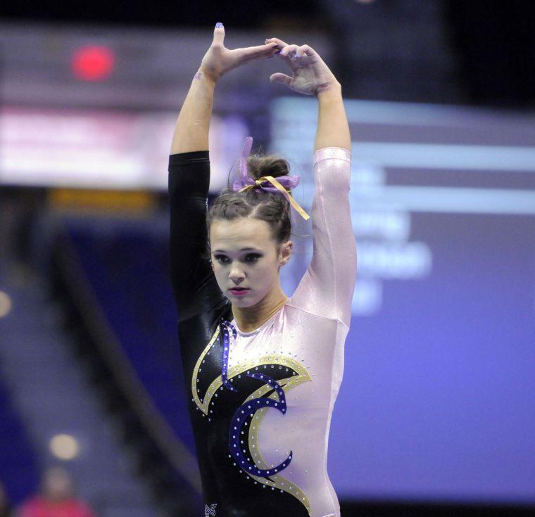 All-around gymnast Ashleigh Gnat performs her beam routine Friday, March 7, 2014 during the Tigers' 197.500 - 195.525 victory against NC State in the Pete Maravich Assembly Center.