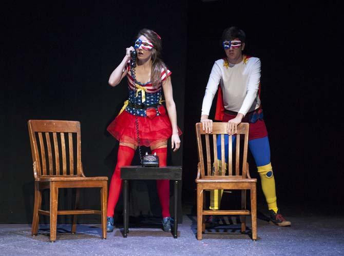 Captain Justice (right, theatre junior Jacob Voisin) and Lady Liberty (left, theatre junior Yvette Bourgeois) answer the phone Sunday, March 9, 2014 during a dress rehearsal of Vampire Cowboy in the Music and Dramatic Arts Building.