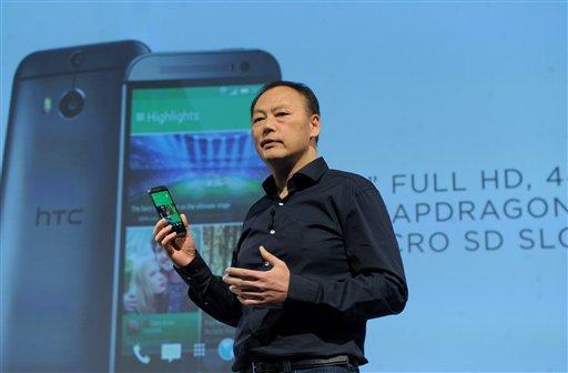 IMAGE DISTRIBUTED FOR HTC - Peter Chou, CEO, HTC Corporation, unveils the HTC One (M8), the company's new flagship smartphone, Tuesday, March 25, 2014, in New York. (Photo by Diane Bondareff/Invision for HTC/AP Images)