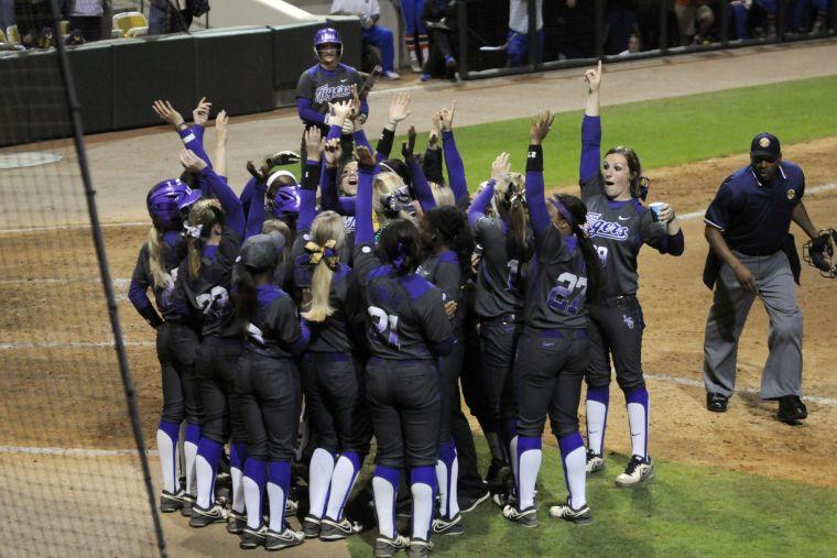 The Lady Tigers celebrate a homerun during the Lady Tigers' 3-2 victory against the Gators on March 15, 2014 at Tiger Park.