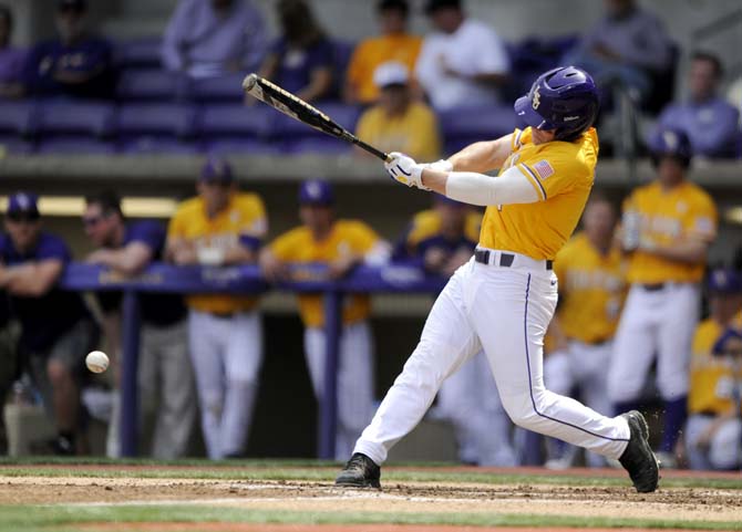 LSU senior outfielder Sean McMullen (7) hits Sunday, Mar. 9, 2014 during the Tigers' 7-3 victory against Purdue.