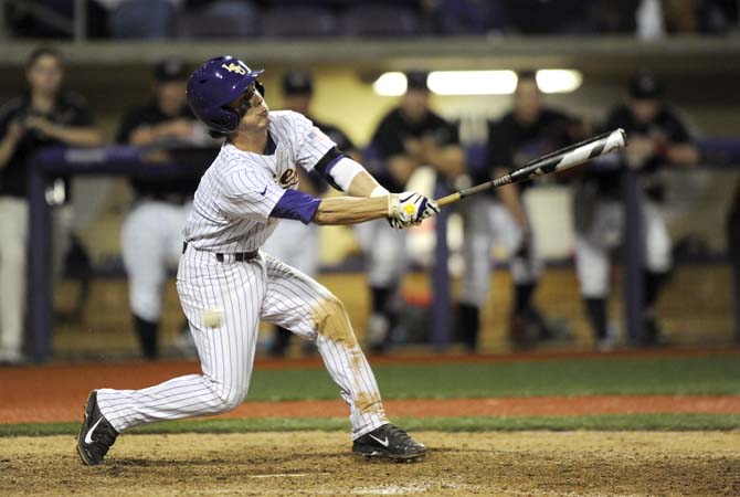 LSU freshman infielder Kramer Robertson (3) strikes out swinging Tuesday, March 11, 2014 during the Tigers' 5-3 win against the Colonels in Alex Box Stadium.