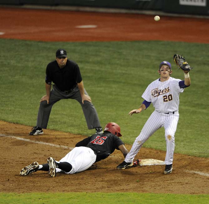 LSU junior infielder Conner Hale (20) tries to catch the ball Tuesday, March 11, 2014 during the Tigers' 5-3 win against Nicholls State in Alex Box Staidum.