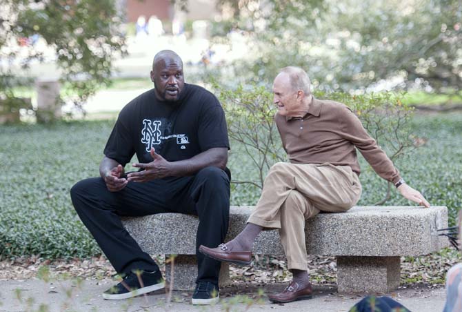 Former LSU basketball player Shaquille O'Neal talks with former LSU basketball coach Dale Brown on Monday in the Quad. Shaq is part of a film with Brown, filming in various locations across campus.