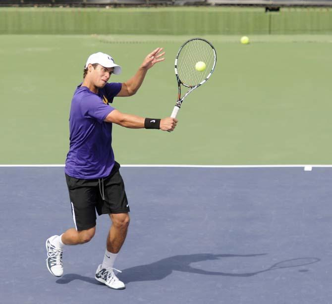 LSu sophomore Harrison Kennedy hits the ball Friday, March 7, 2014 during a tennis match against Alabama in W.T. "Dub" Robinson Stadium.