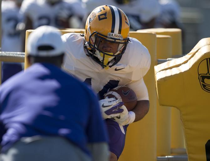 LSU senior running back Terrence Magee (14) partcipates in drills Tuesday, March 18, 2014 during practice at the Charles McClendon Practice Facility.