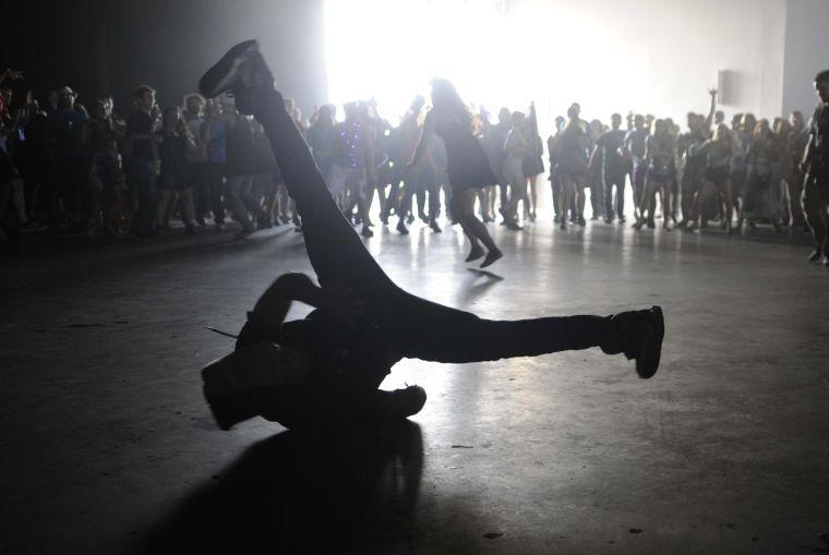 A festival-goer break dances to Dan Deacon's set during Buku Music + Art Project on Saturday, March 22, 2014 at Mardi Gras World in New Orleans.