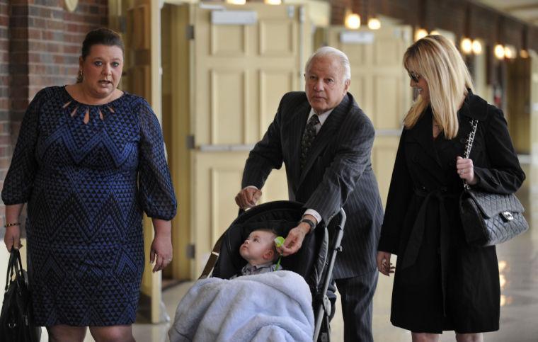 Former Louisiana Gov. Edwin Edwards, center, walks down the hallway pushing his son, Eli, as he is accompanied by wife Trina Scott Edwards, right, and Charlotte Guedry, left, before speaking at the Baton Rouge Press Club in Baton Rouge, La., Monday, March 17, 2014. Edwards announced that he would join the race to represent the state&#8217;s Baton Rouge-based 6th District of the U.S. House of Representatives. (AP Photo/Travis Spradling)