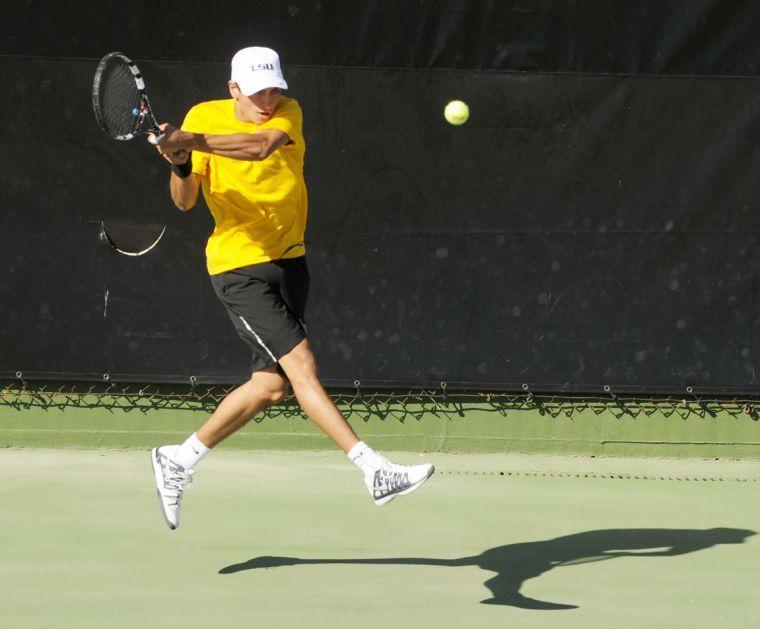 LSU freshman Justin Butsch hits the ball during a match against George Washinton University on March 13, 2014 at the W.T. &#8220;Dub&#8221; Robinson Stadium.