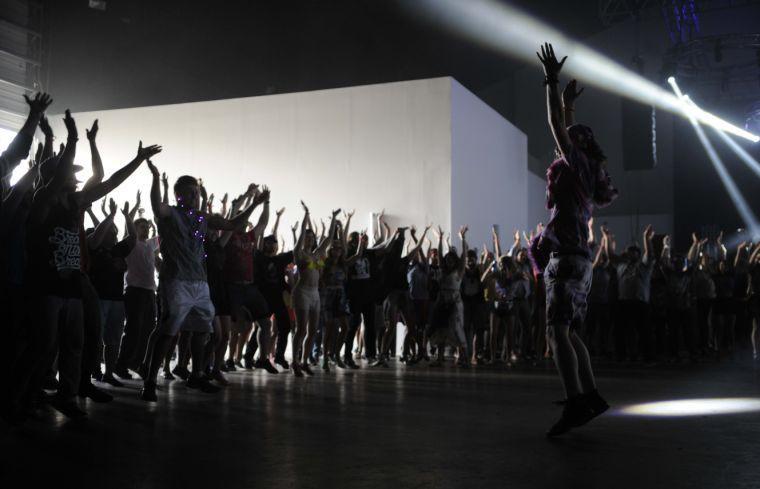 A festival-goer leads others in a dance at the Dan Deacon show during Buku Music + Art Project on Saturday, March 22, 2014 at Mardi Gras World in New Orleans.