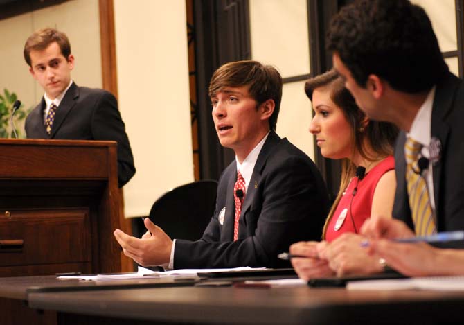 Student Government presidential candidate Christian Coleman from the Experience LSU ticket answers a question Monday, March 17, 2014 during the 2014 Student Government Debate held in the Holliday Forum.