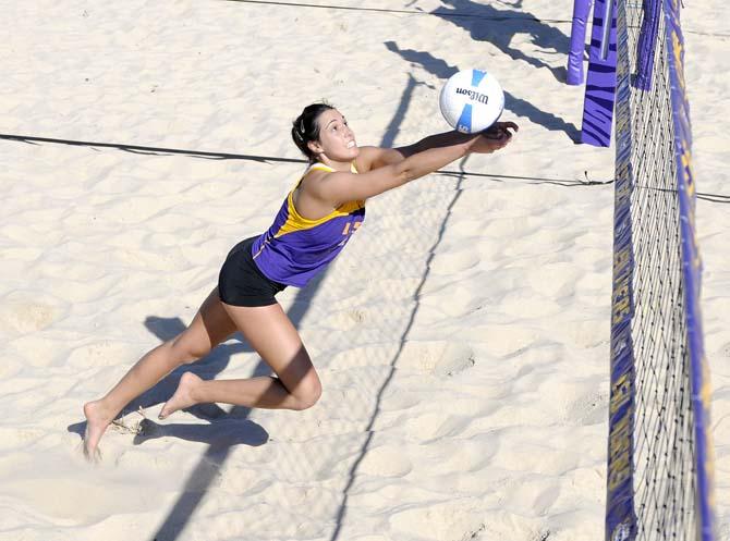 LSU freshman Katarina Raicevic (11) leaps to hit the ball Wednesday, March 12, 2014 during a scrimmage at Mango's Outdoor Volleyball.