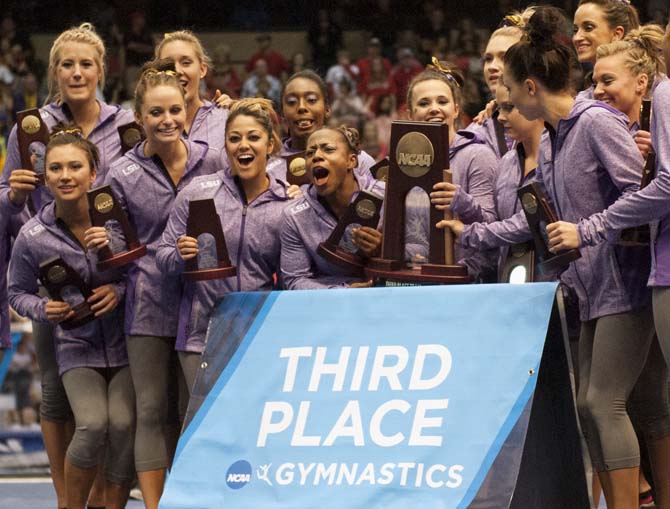 The LSU gymnastics team celebrates after placing third Saturday, April 19, 2014 at the NCAA Super Six Finals in Birmingham, Ala. The Lady Tigers received a score of 197.600. Florida and Oklahoma tied for first place with a score of 198.175.