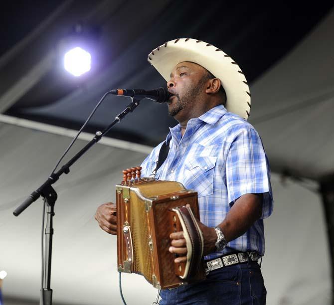 Jeffery Broussard of Jeffery Broussard and the Creole Cowboys plays the accordion Saturday, April 26, 2014, during the New Orleans Jazz and Heratige Festival.