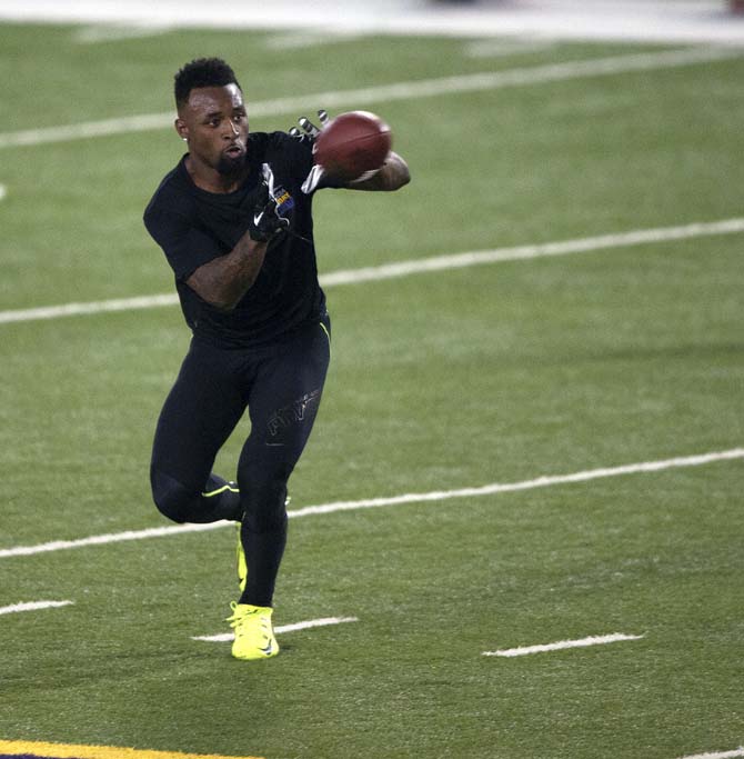 LSU junior wide receiver Jarvis Landry (80) catches a pass on Wednesday, April 9, 2014 during LSU Pro Day in the LSU Indoor Practice Facility.