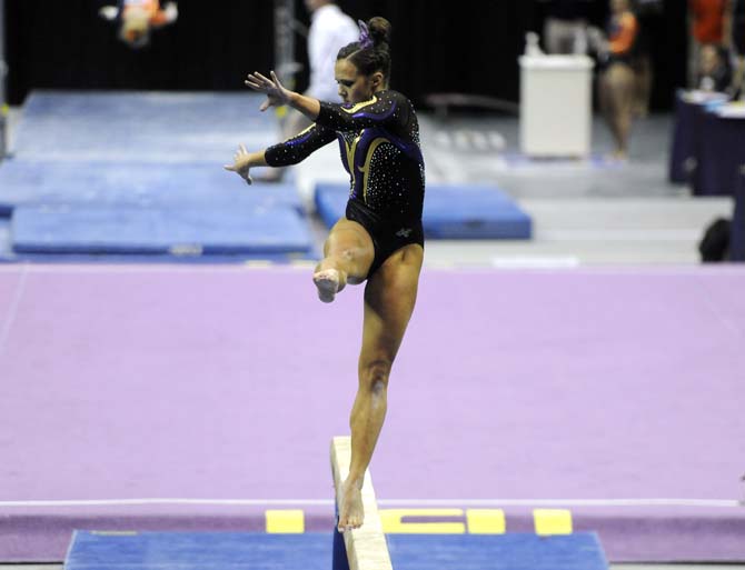 LSU freshman all-around Ashleigh Gnat performs her beam routine Saturday, April 5, 2014, during the NCAA Gymnastics Regional in the PMAC. The Tigers won the meet with a school-record score of 198.325.